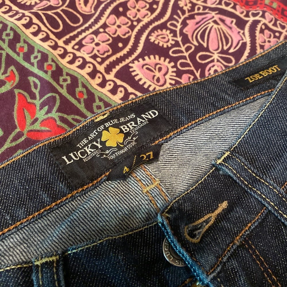 Never worn. Dark denim Lucky Brand low rider Zoe Boot Cut Jeans.